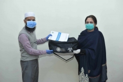 Participant receiving PPE kit after completion of BRM online training