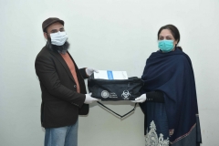 Participant receiving PPE kit after completion of BRM online training